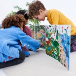 Kids playing with ZIGZAG Dinosaurs Book